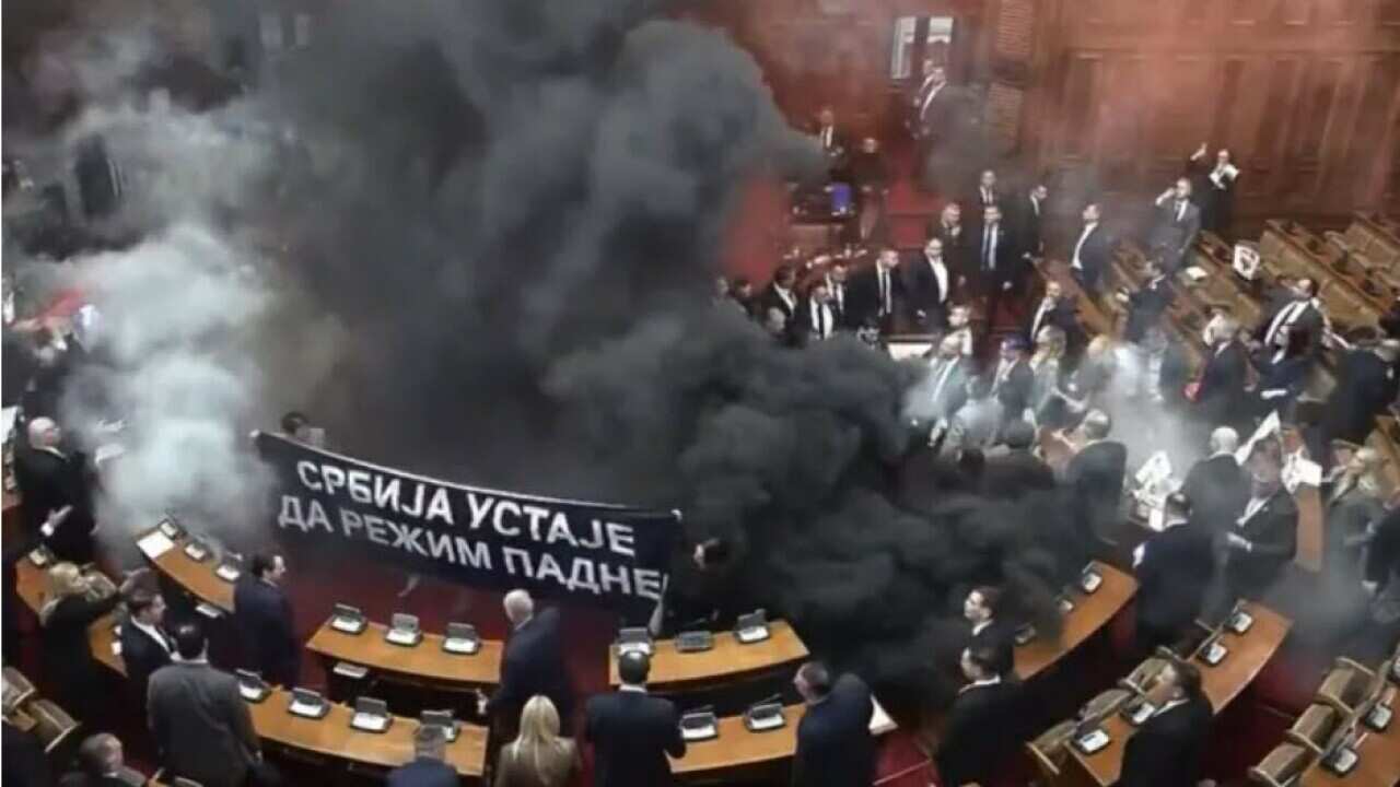 Serbian opposition sets parliament on fire with smoke bombs and tear gas.jpg