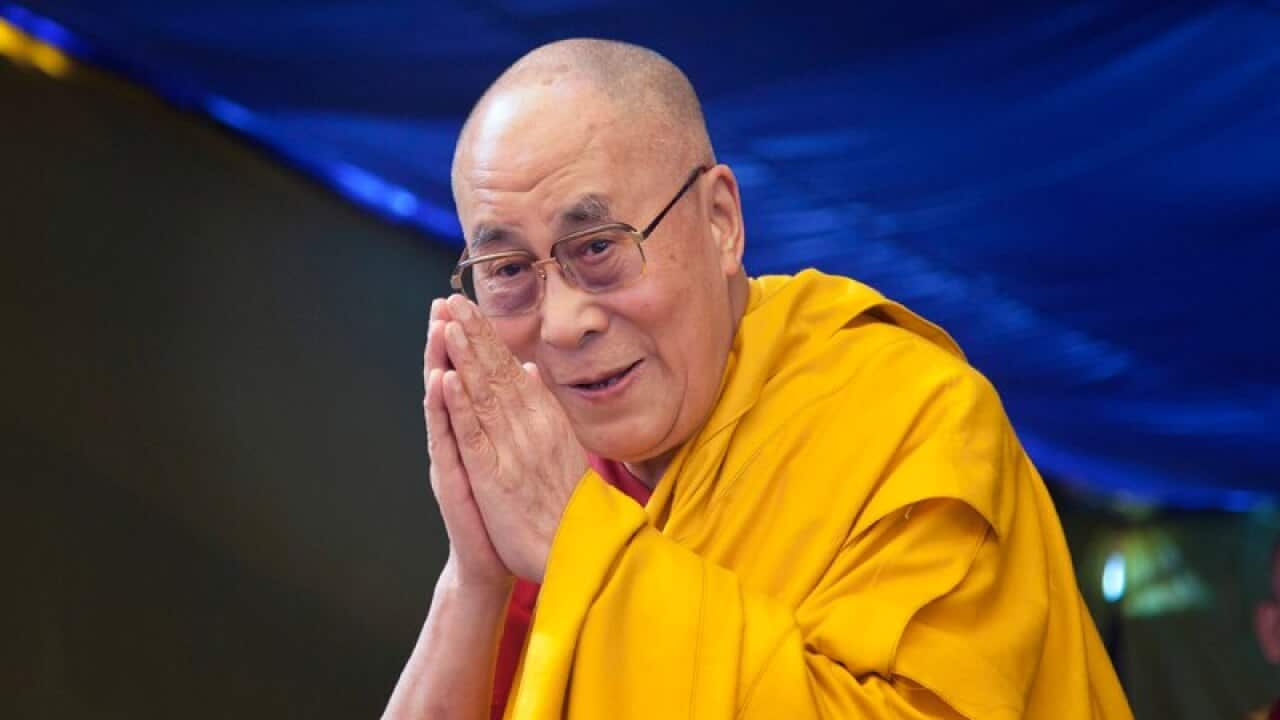 Tibetan spiritual leader the Dalai Lama greets devotees as he arrives to give a religious talk at the Tibetan Children's Village School in Dharmsala, India, Wednesday, May 27, 2015. Every year Dalai Lama gives teachings to young Tibetans at the school.