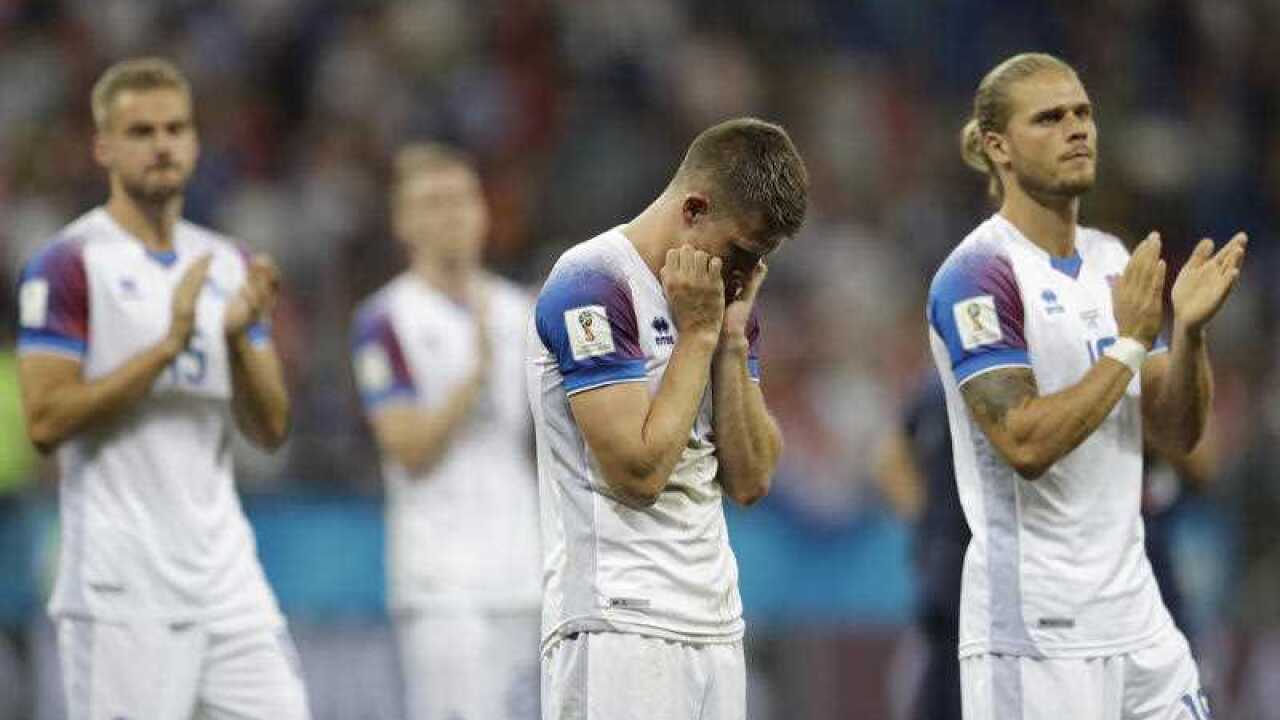 From left, Iceland's Holmar Eyjolfsson, Johann Gudmundsson and Rurik Gislason leave the pitch at the end of the group D match between Iceland and Croatia.