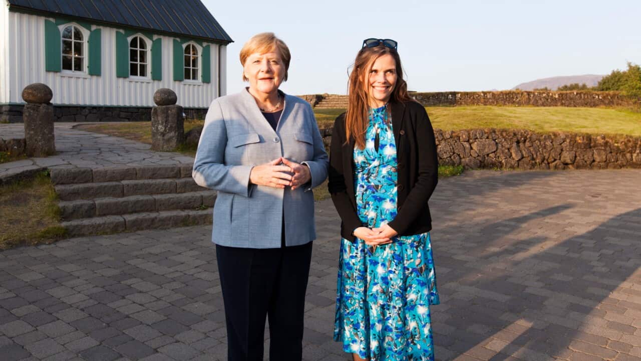 German Chancellor Angela Merkel (L) is welcomed by Icelandic Prime Minister Katrin Jakobsdottir (R) in Thingvellir national park