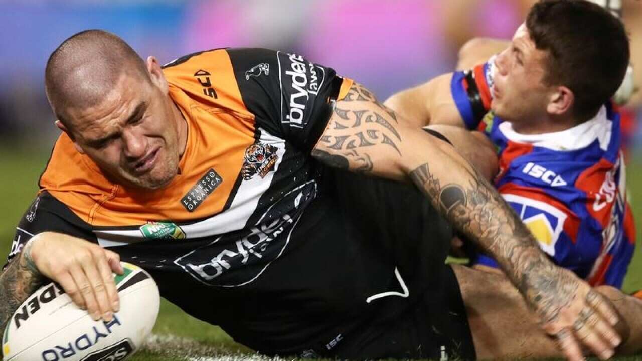 Wests tigers froward Russell Packer scores a try