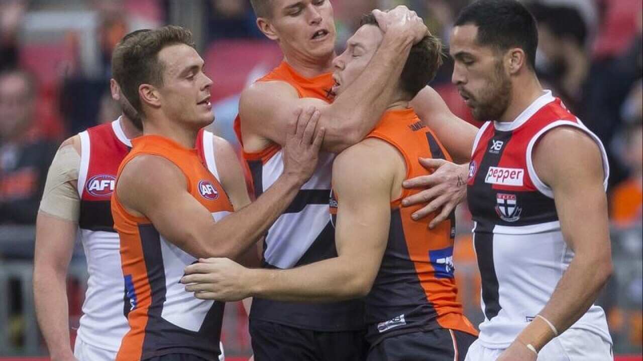 GWS Giants players celebrate a goal by Rory Lobb.