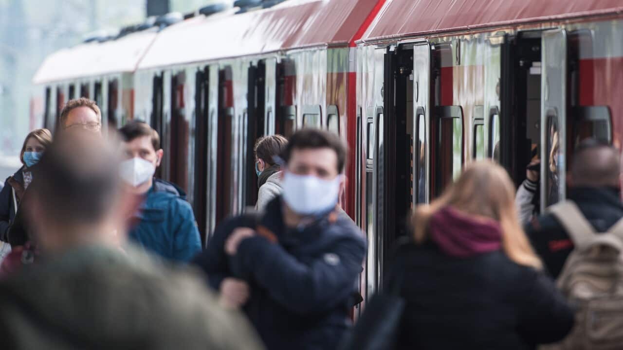 Passengers are seen wearing face masks at Hamburg subway station