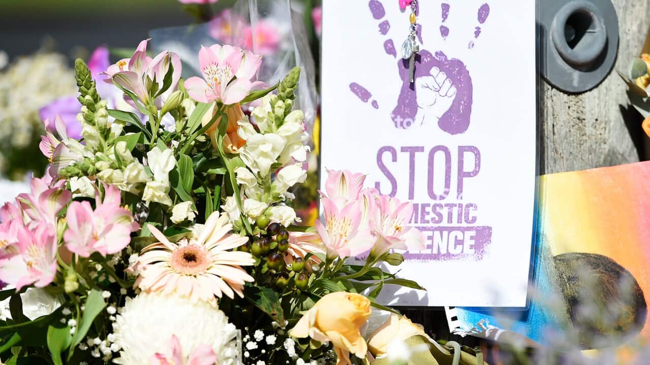 A floral tribute at a domestic violence memorial (AAP).jpg