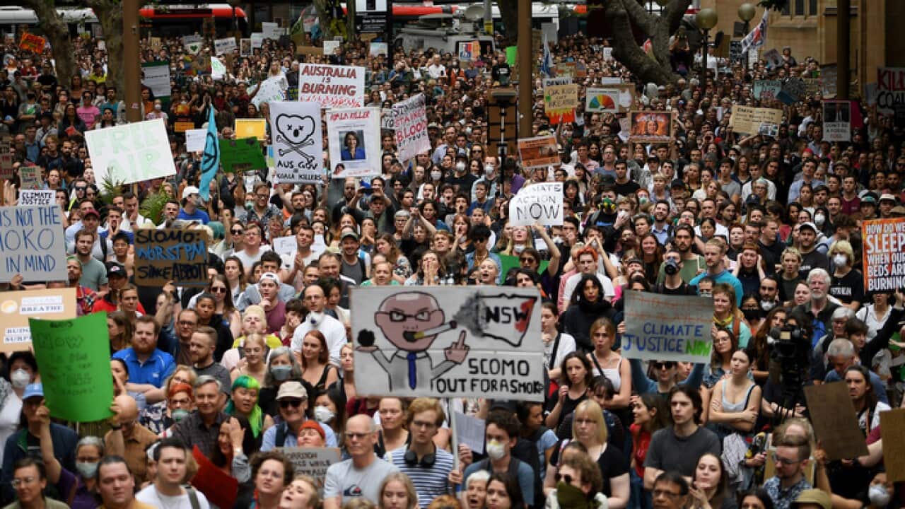 Protesters rally during the "NSW is Burning, Sydney is Choking" Climate Emergency Rally organised by Uni Students for Climate Justice in Sydney, Wednesday, December 11, 2019. (AAP Image/Dan Himbrechts) NO ARCHIVING