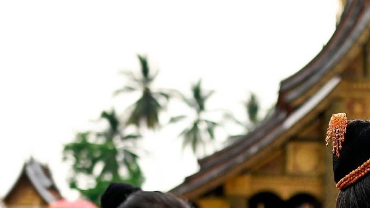 People pray at Wat Xianthong pagoda during new year celebrations in Luang Prabang on April 15, 2019. (MANAN VATSYAYANA - AFP via Getty Images)