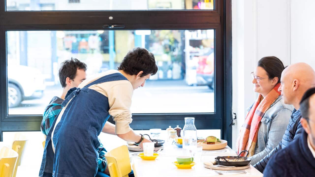 All Things Equal Trainee, Harley Rose serving customers