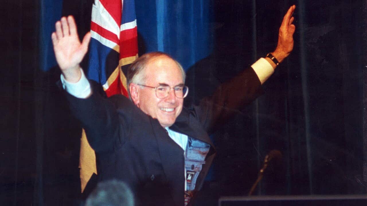 Sydney, May 20, 2004. FILE PIC FROM 1996 - Liberal party leader John Howard waves to the crowd in a Sydney Hotel on 2 March, 1996, as he acknowledges his federal election victory. (AAP Image) NO ARCHIVING
