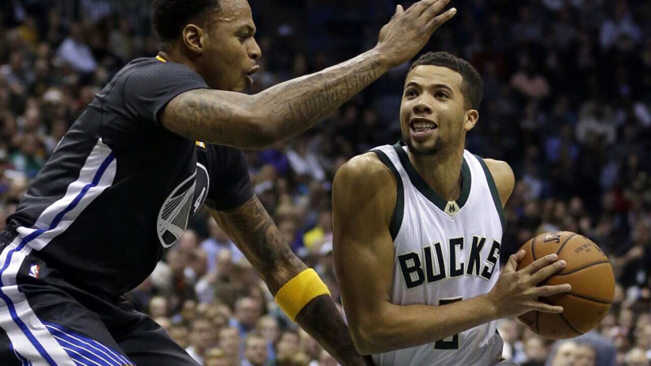 Michael Carter-Williams and Golden State Warriors' Brandon Rush
