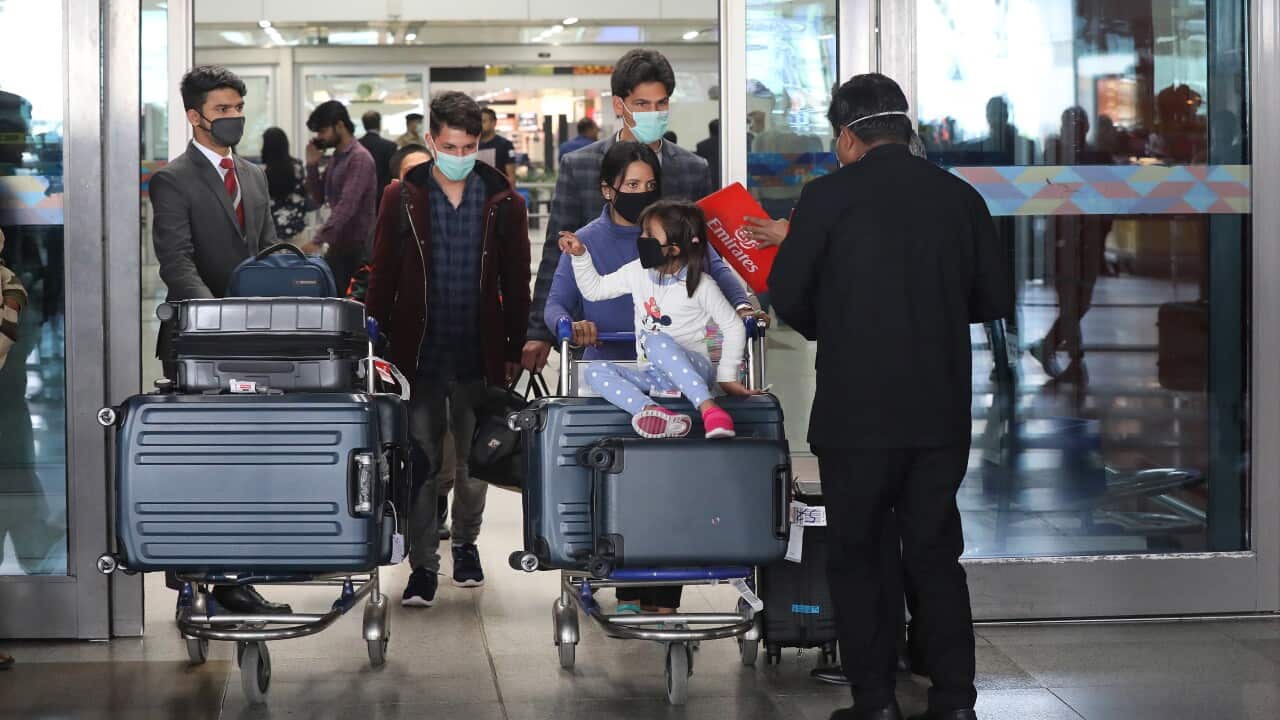 Passengers at the Indira Gandhi International airport in New Delhi, India, 12 March 2020.