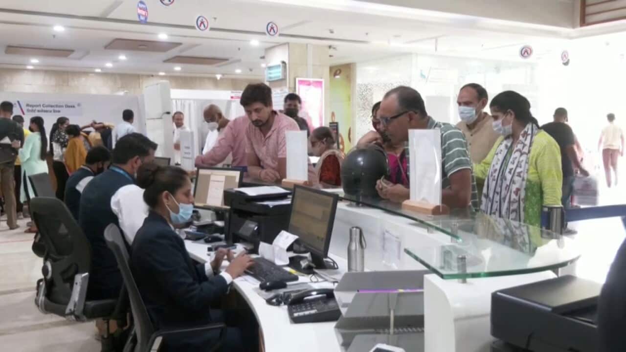 People queuing at the reception desk at the Aakash Healthcare hospital (Reuters).jpg
