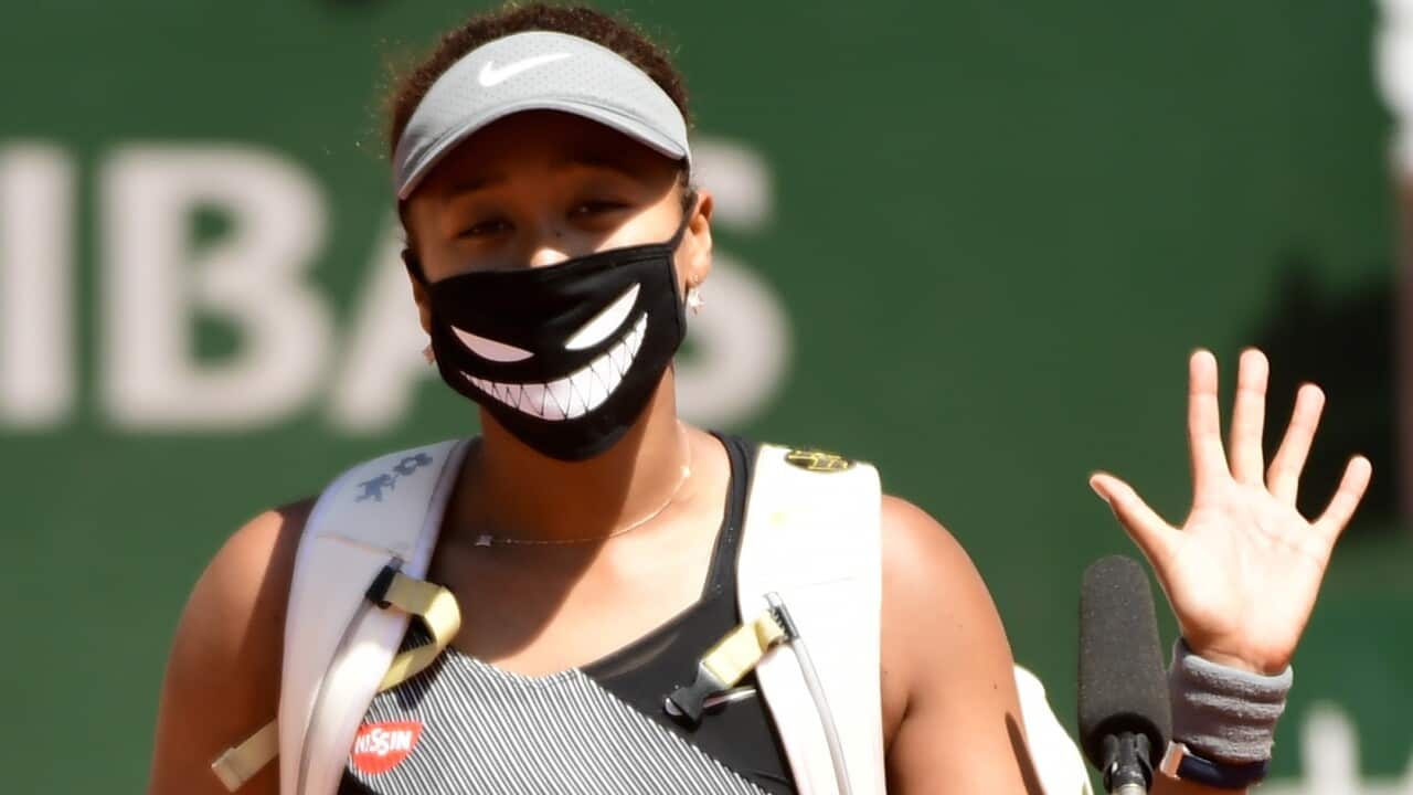 epa09239786 (FILE) - Naomi Osaka of Japan celebrates winning against Patricia Maria Tig of Romania during their first round match at the French Open tennis tournament at Roland Garros in Paris, France, 30 May 2021 (re-issued 31 May 2021). Osaka announced