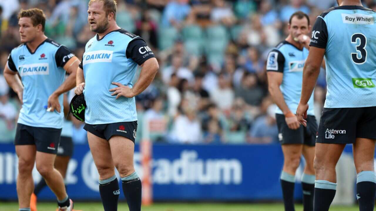 NSW Waratahs players react after conceding a goal