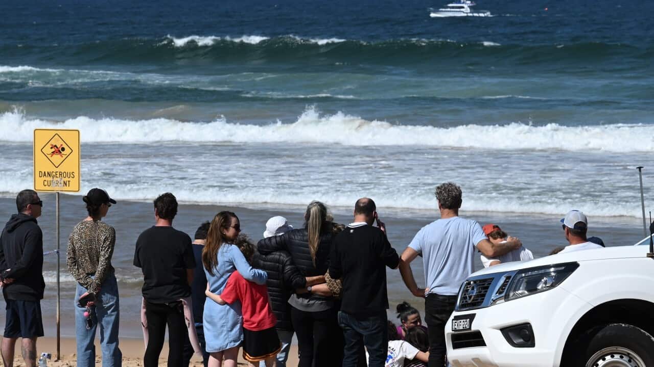 Family, friends and local residents gather at Long Reef Beach