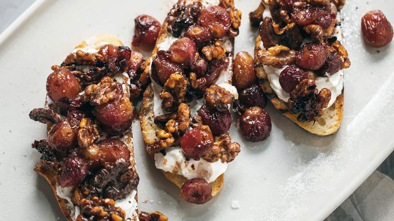 Tartines with labne, roasted red grapes and walnuts