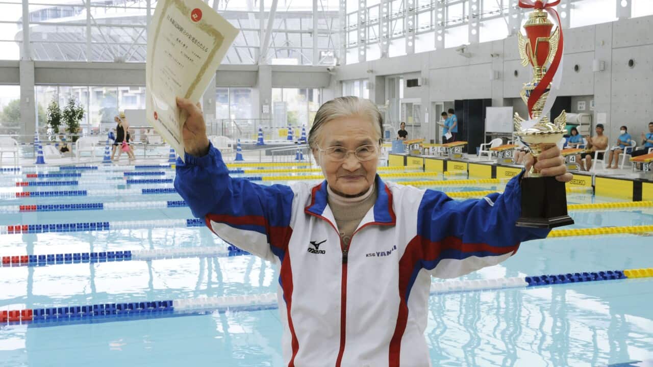 Mieko Nagaoka, a 100-year-old Japanese swimmer, celebrates after successfully swimming 1,500 meters in 1 hour, 15 minutes, 54.39 seconds in a masters swimming competition in Matsuyama, western Japan, on April 4, 2015. (Kyodo)==Kyodo
