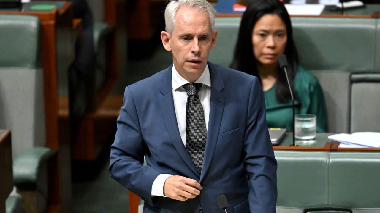 A man in parliament wearing a suit