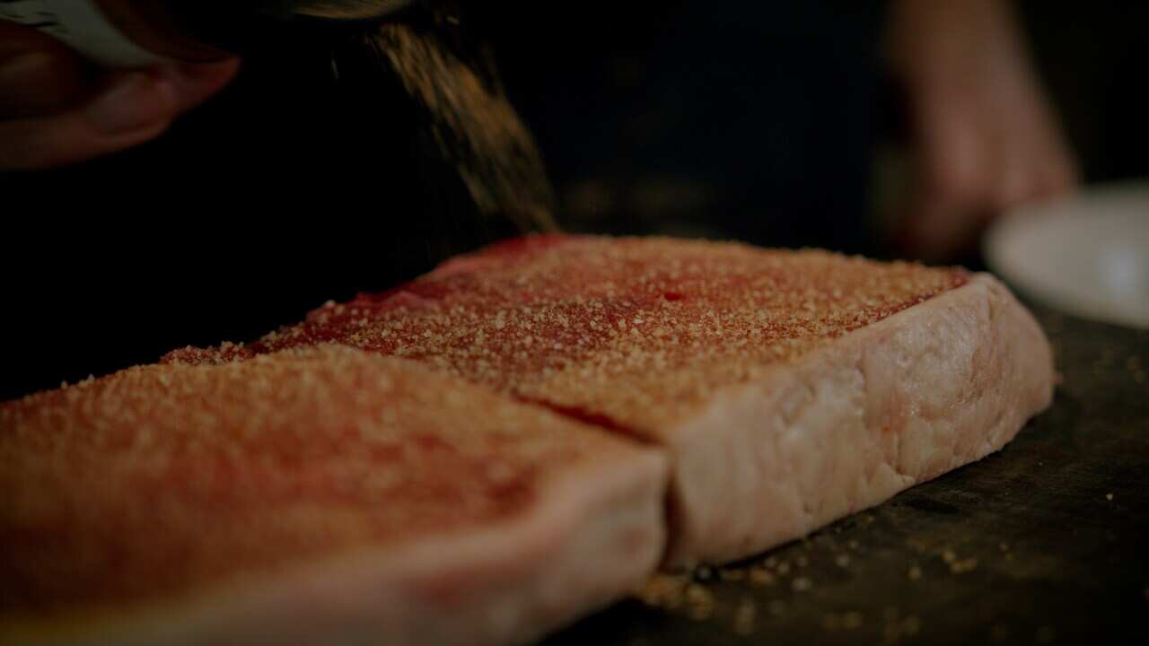 Chicken salt bring sprinkled on meat – courtesy of Salt of the Earth.jpg