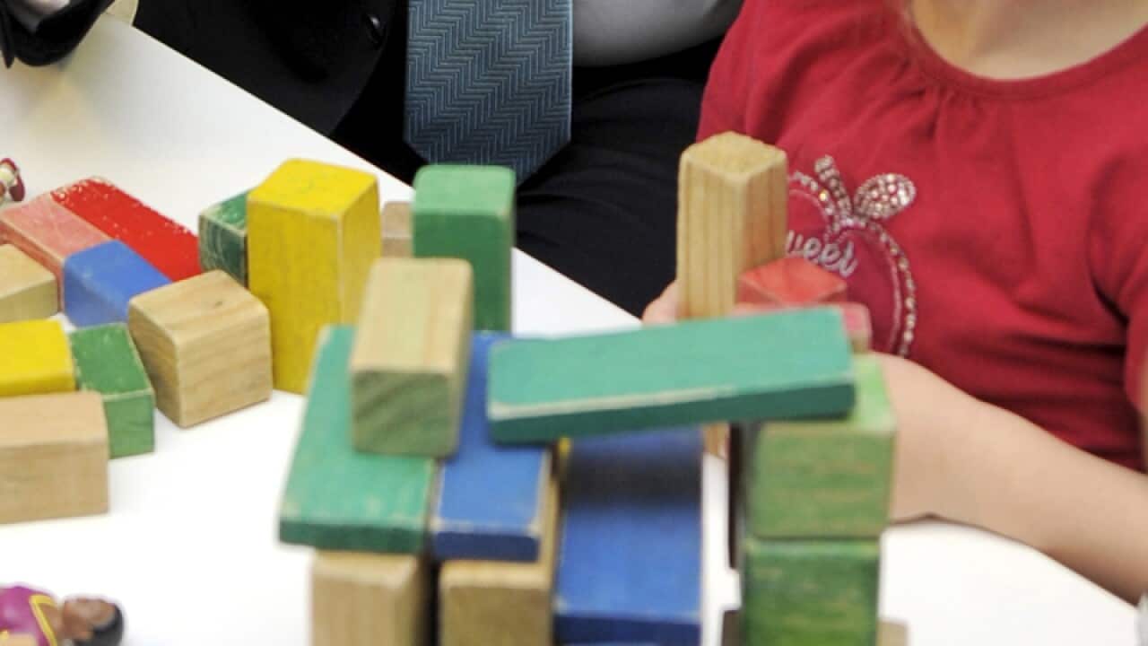 A child plays with toys.