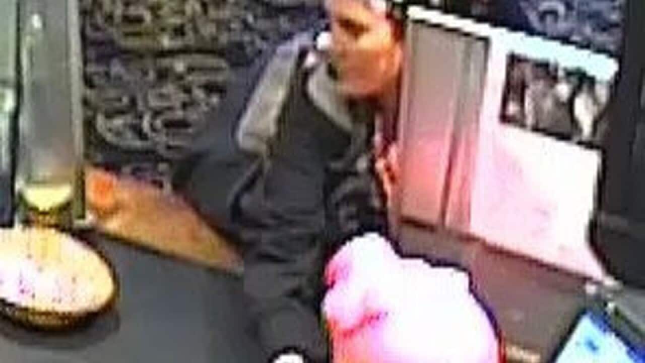 CCTV footage of a woman stealing a large piggy bank