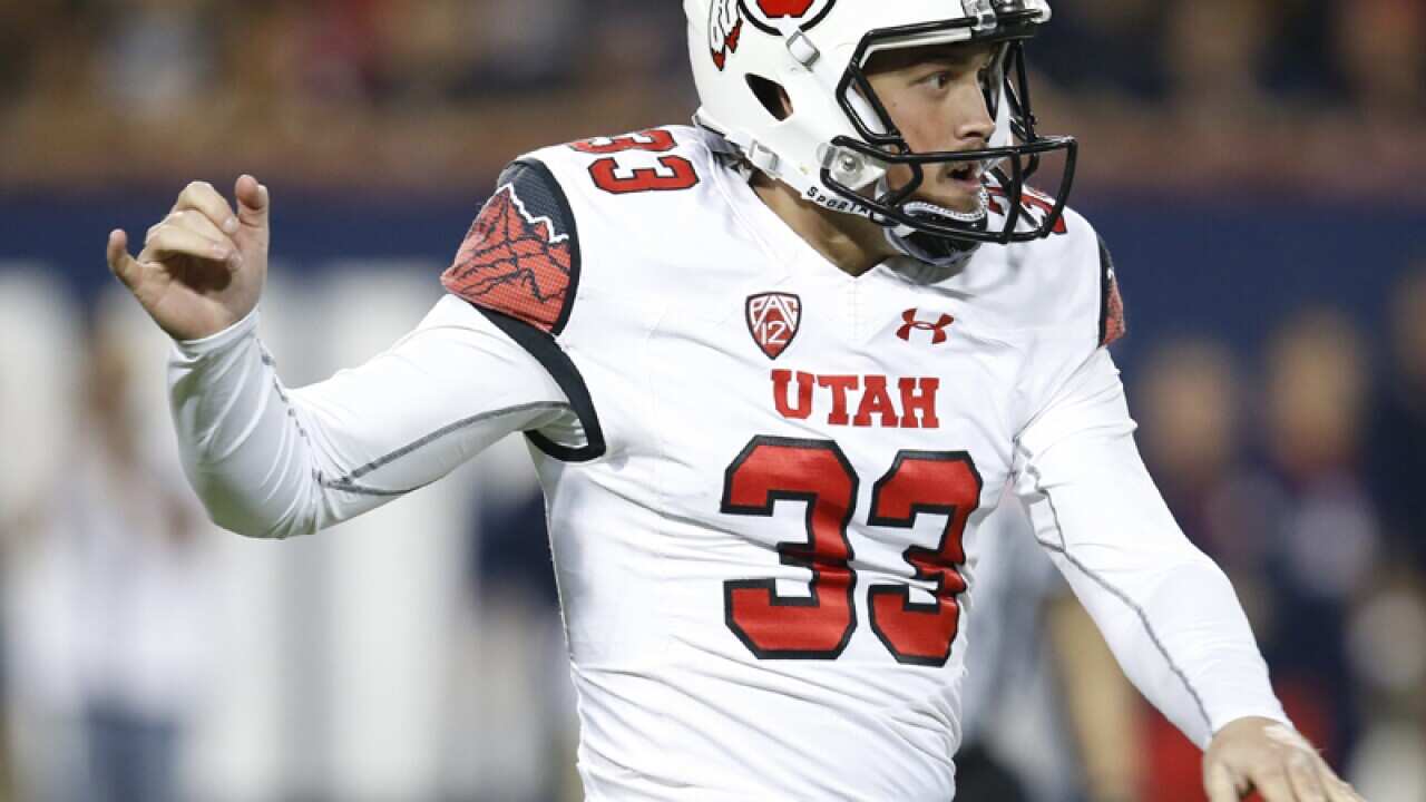 Utah punter Tom Hackett (33)