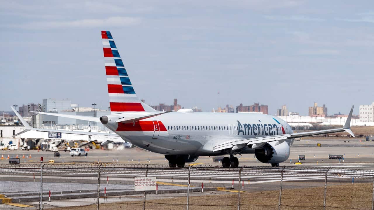 An American Airlines Boeing 737 Max 8 (Tail Number N350RV) prepares for takeoff at LaGuardia Airport in New York, USA.