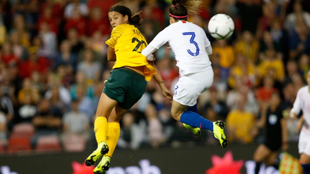 Sam Kerr of the Matildas (left) in action in a friendly against Chile last year