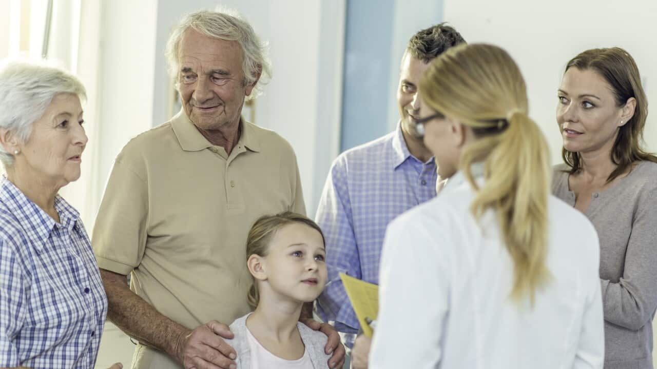 Multi generation family visit at doctor's office