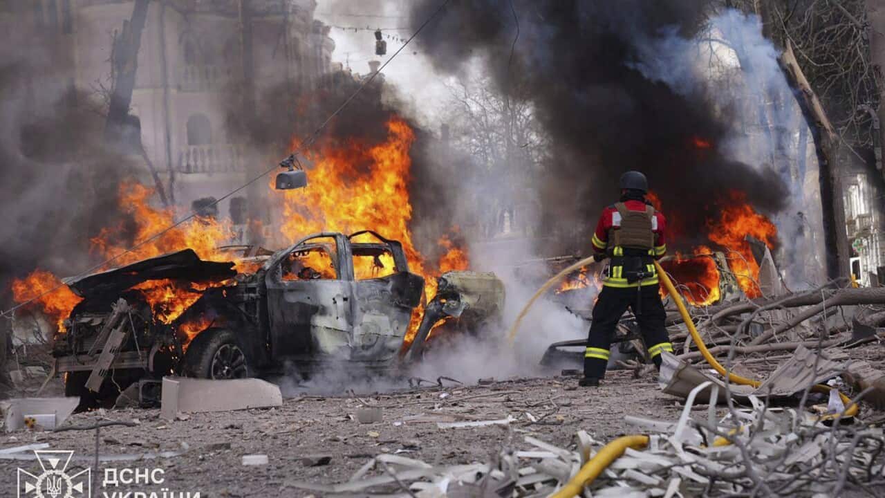 firefighters put out the fire following Russia's missile attack that killed civilians in Sumy, Ukraine