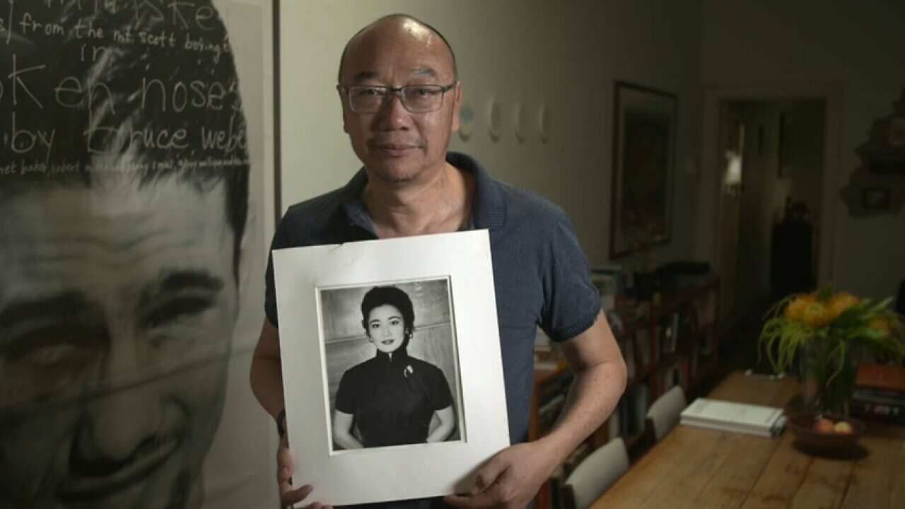 Tony Ayres with a photo of his mother (SBS)
