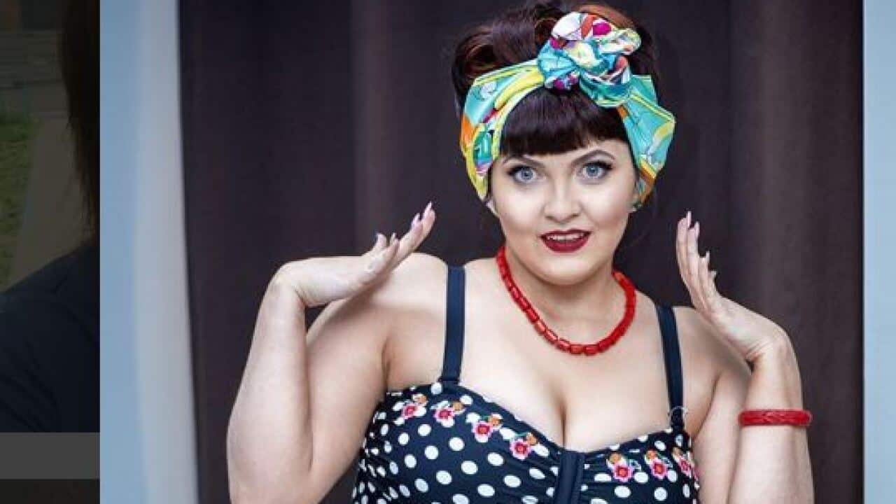 Ms Popova was fired after participating in a pinup swimsuit photo-shoot.