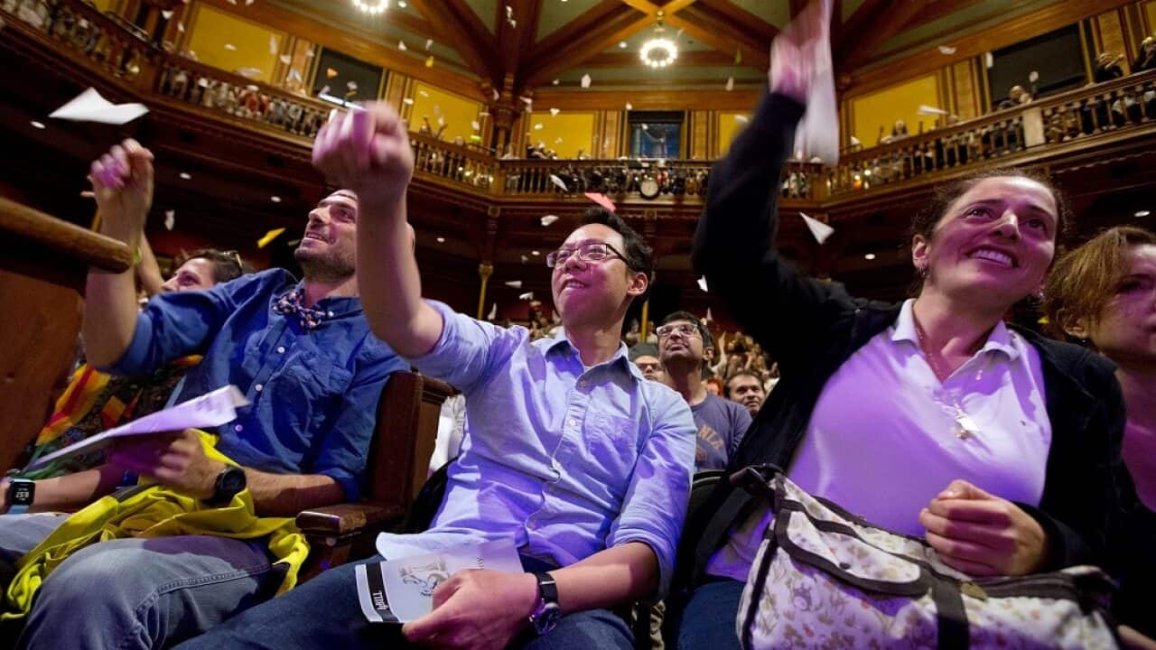 Audience members launch paper planes during Ig Nobel award ceremonies.