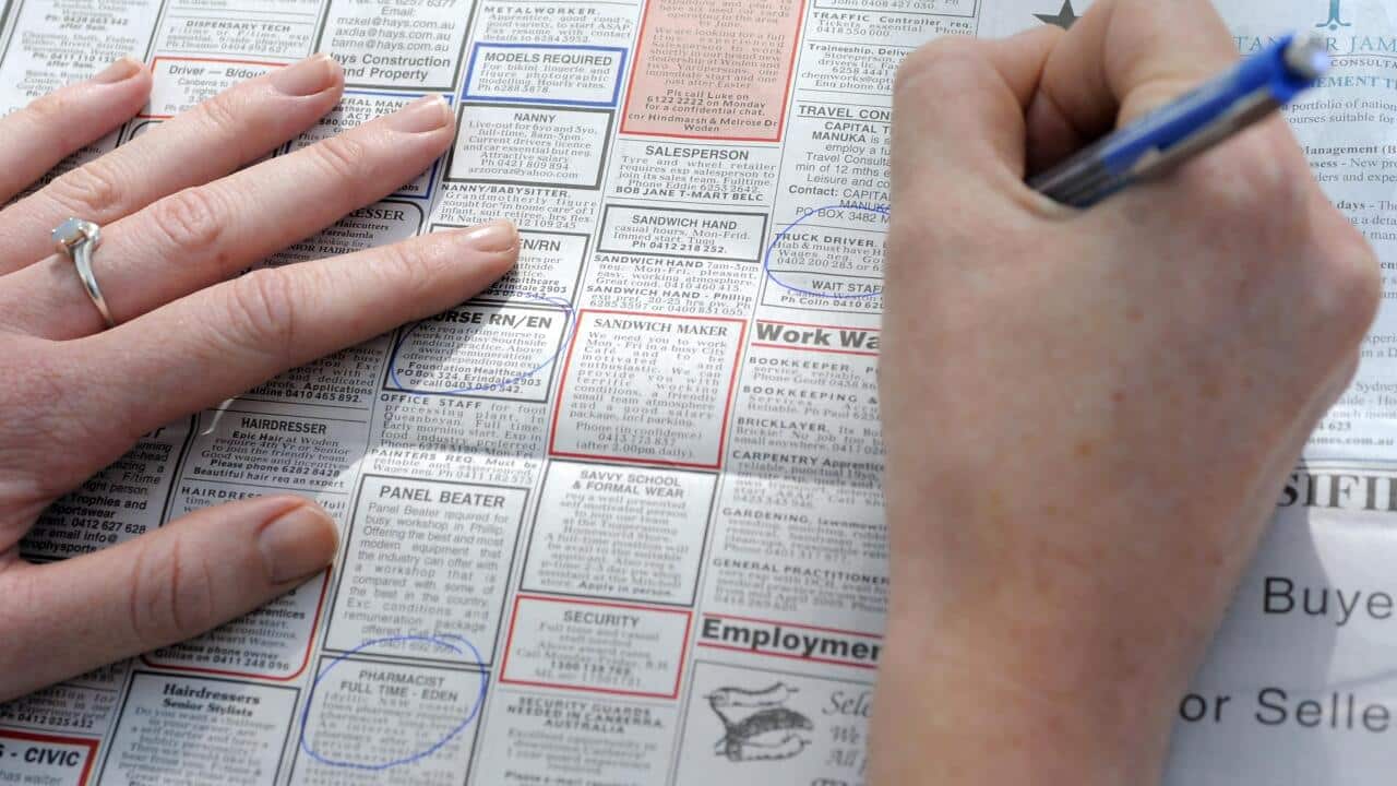 Newspaper job advertising in Canberra, Thursday, April 9, 2009. The jobless rate has soared to 5.7 per cent, rising at a faster pace than the government predicted just a few months ago. (AAP Image/Alan Porritt) NO ARCHIVING