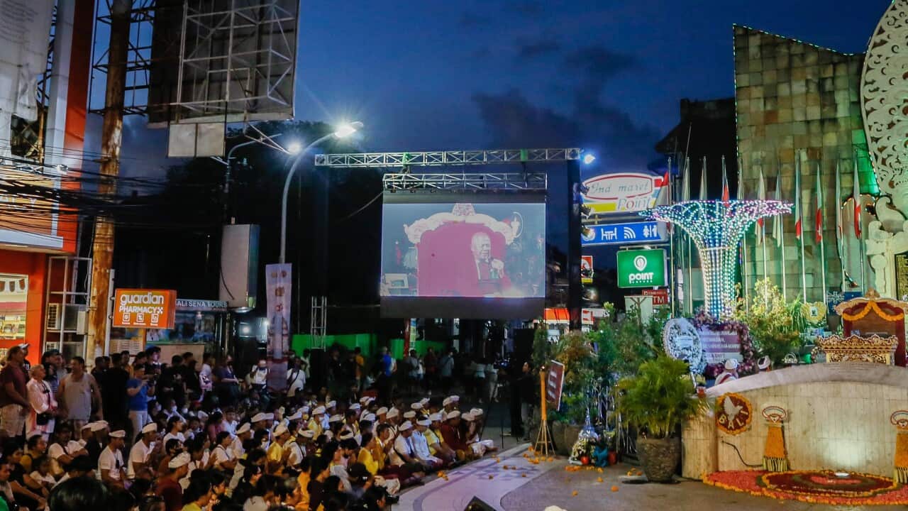 People watch a video at the Bali bombing commemorations in Kuta.