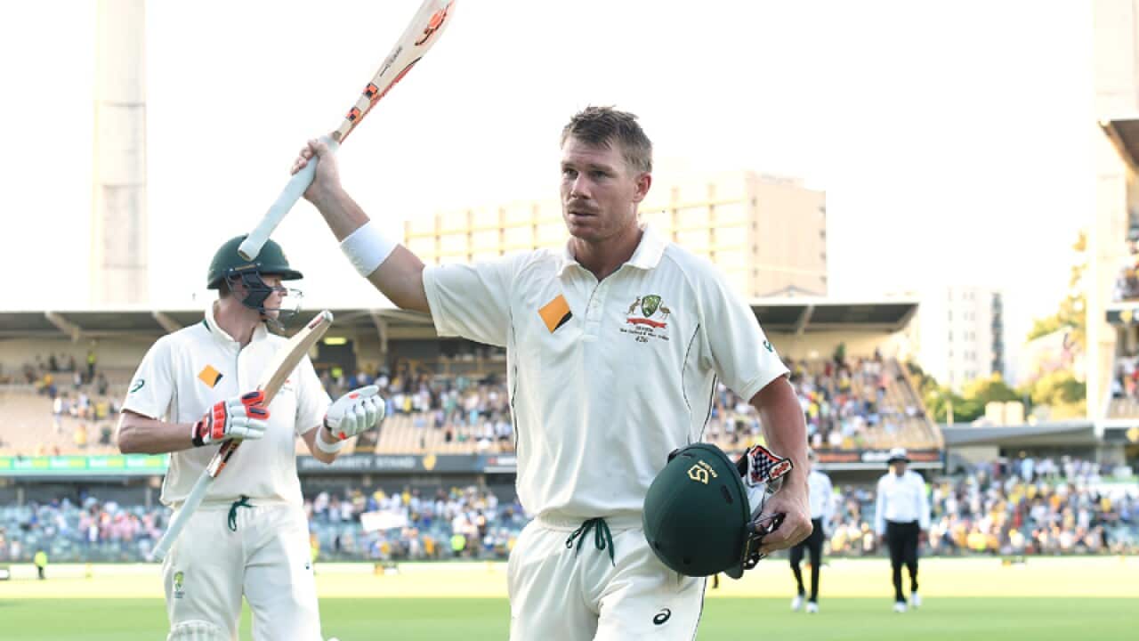 Australian batsman David Warner raises his bat at the WACA