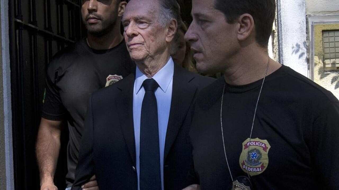 Carlos Nuzman (centre) is arrested.