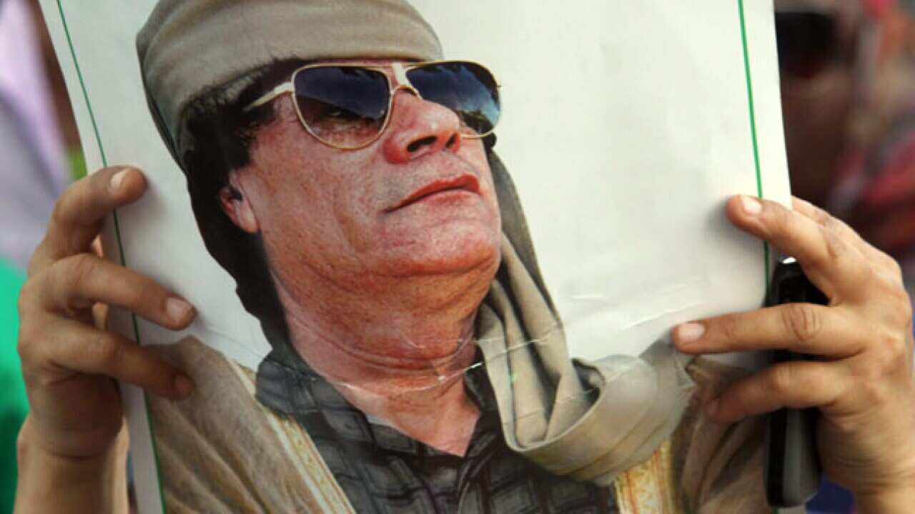 gaddafi_poster_20110703_b_aap_1441077965