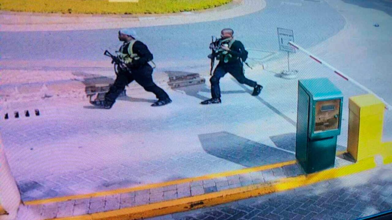 Security camera footage shows heavily armed attackers in the compound of a hotel, in Nairobi, Kenya