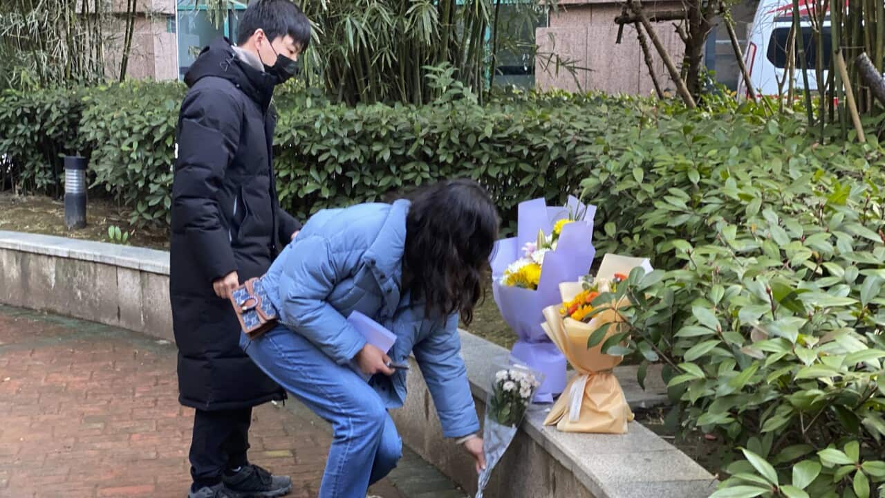 Residents visiting the Wuhan Central Hospital offer flowers in memory of whistleblower Li Wenliang