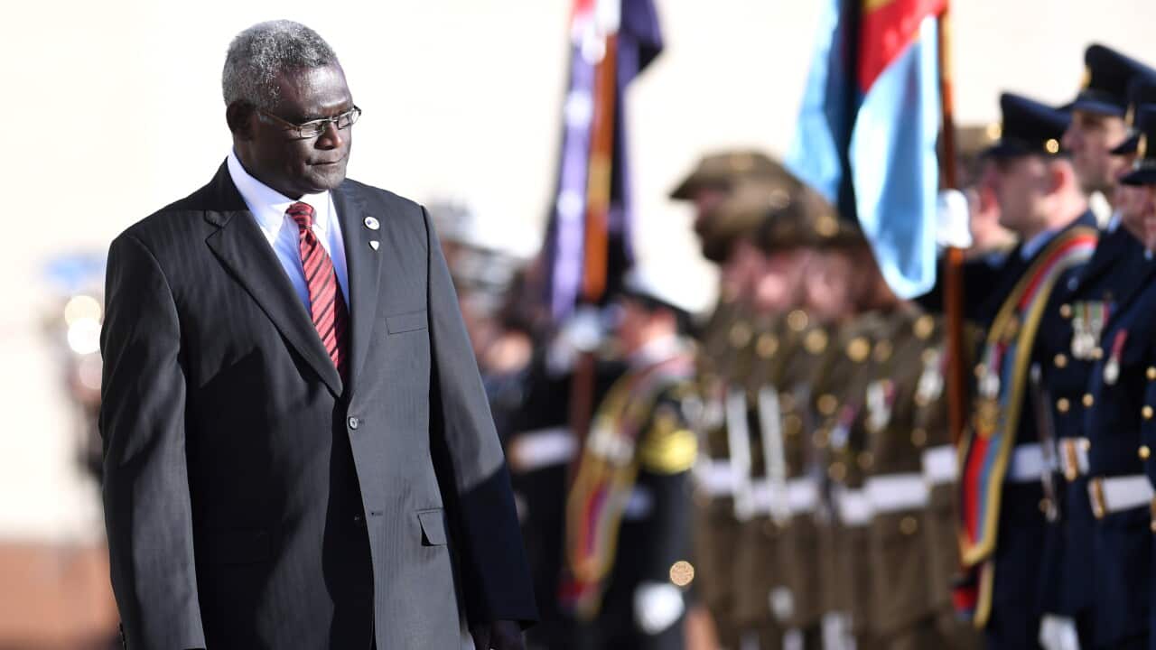 Prime Minister of the Solomon Islands Manasseh Damukana Sogavare inspects the guard of honour during a ceremonial welcome at Parliament House in Canberra, Monday, August 14, 2017.  (AAP Image/Lukas Coch) NO ARCHIVING
