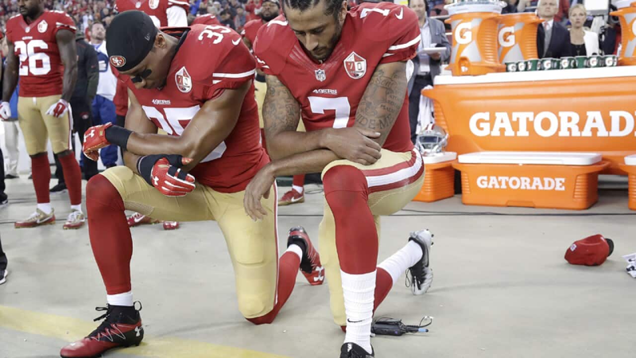 San Francisco 49ers Eric Reid (L) and Colin Kaepernick
