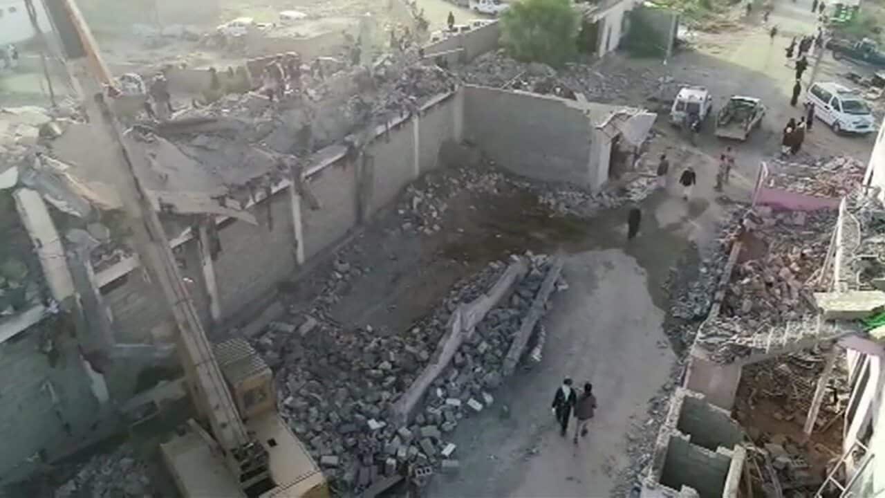 Rescuers working at the site of damaged prison after an alleged Saudi-led airstrike in Saada, Yemen.