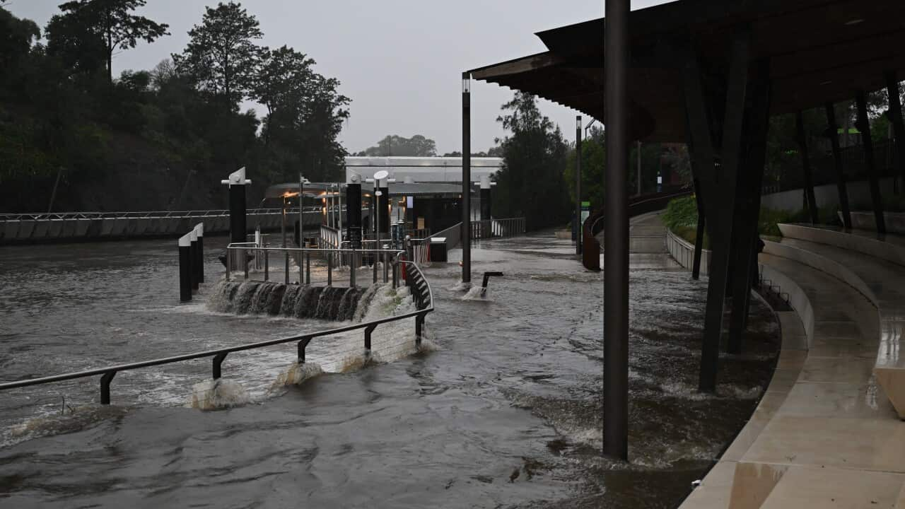 Floodwaters inundate a wharf.