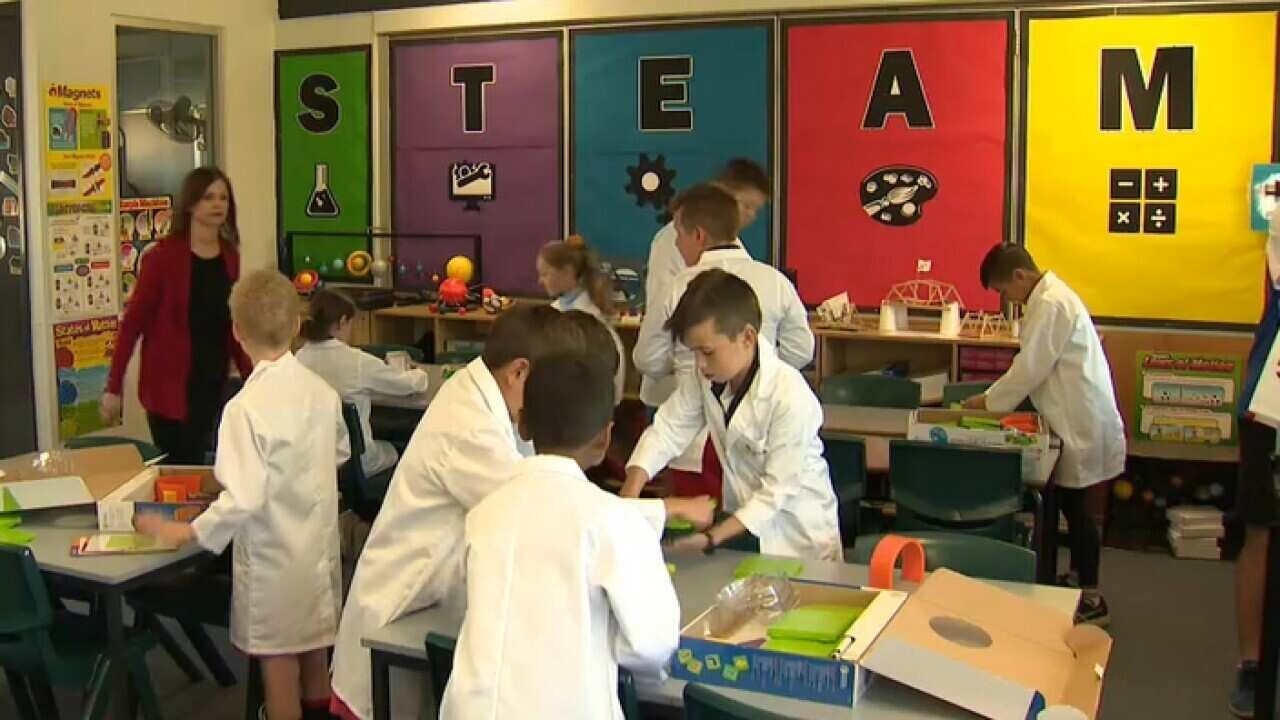 Natalie Chapman with students in the STEAM room