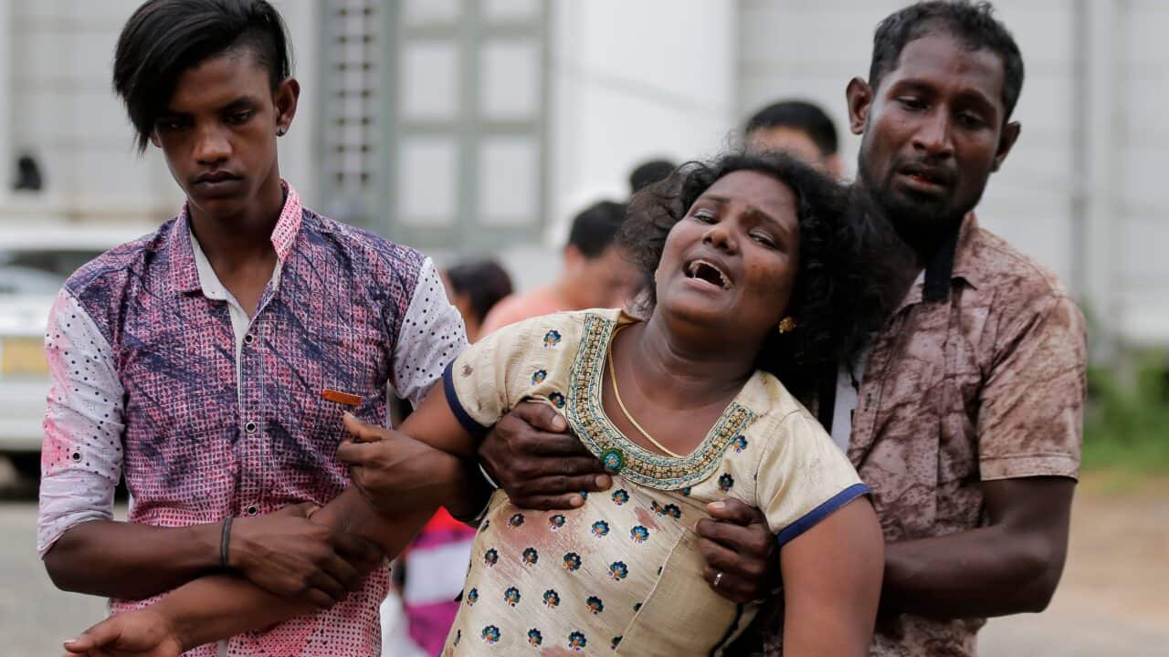 Relatives of a blast victim grieve outside a morgue in Colombo, Sri Lanka, Sunday, April 21, 2019.