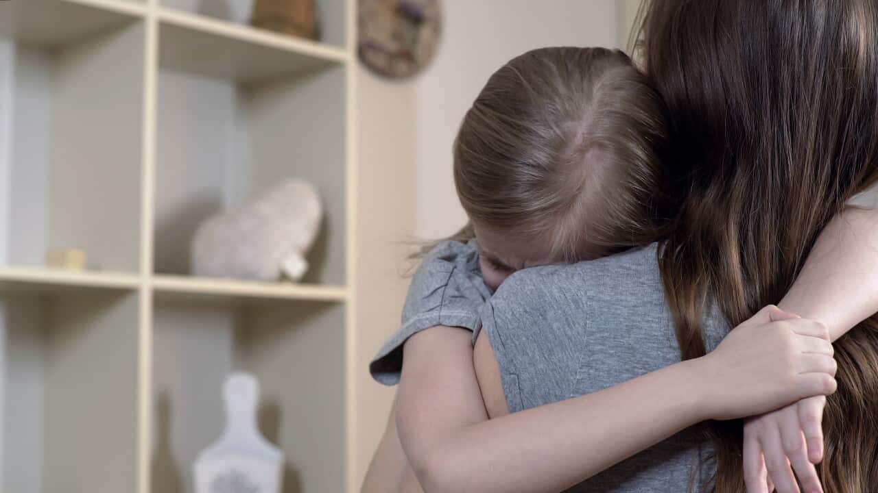 Sad daughter tightly hugging her mother telling about her problems, mother love