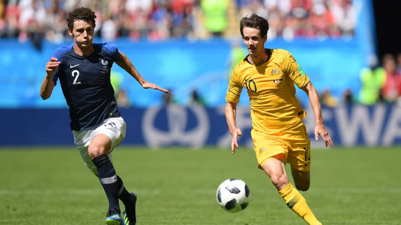 Benjamin Pavard of France and Robbie Kruse of Australia battle for the ball during the 2018 FIFA World Cup Russia group C 