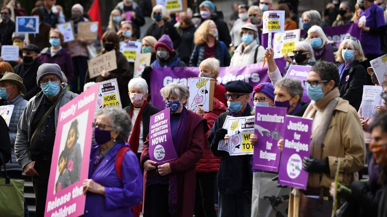 Protesters are seen during a rally at the State Library of Victoria in Melbourne, Saturday, June 19, 2021.