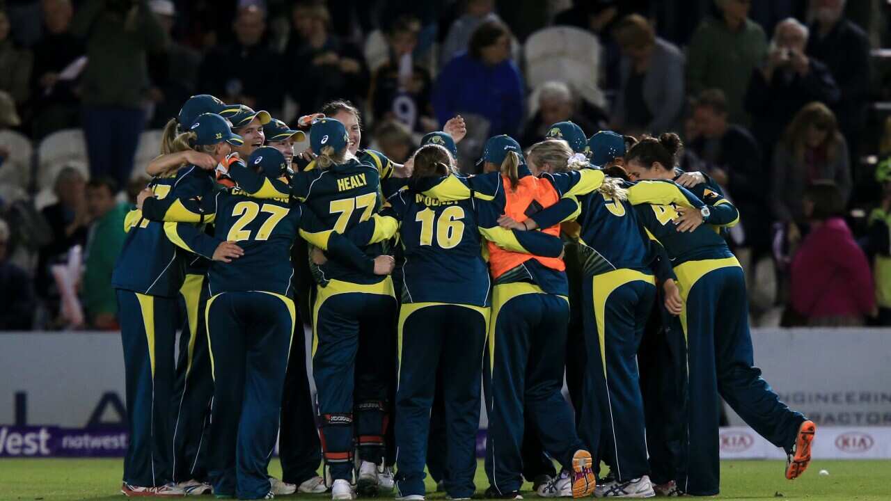 Australia's players celebrate winning the match and the overall series during the second Twenty20 match of the Women's Ashes series