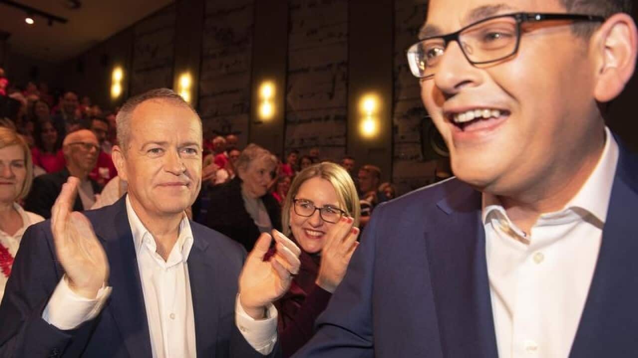 Federal Labor leader Bill Shorten applauds Premier Dan Andrews.